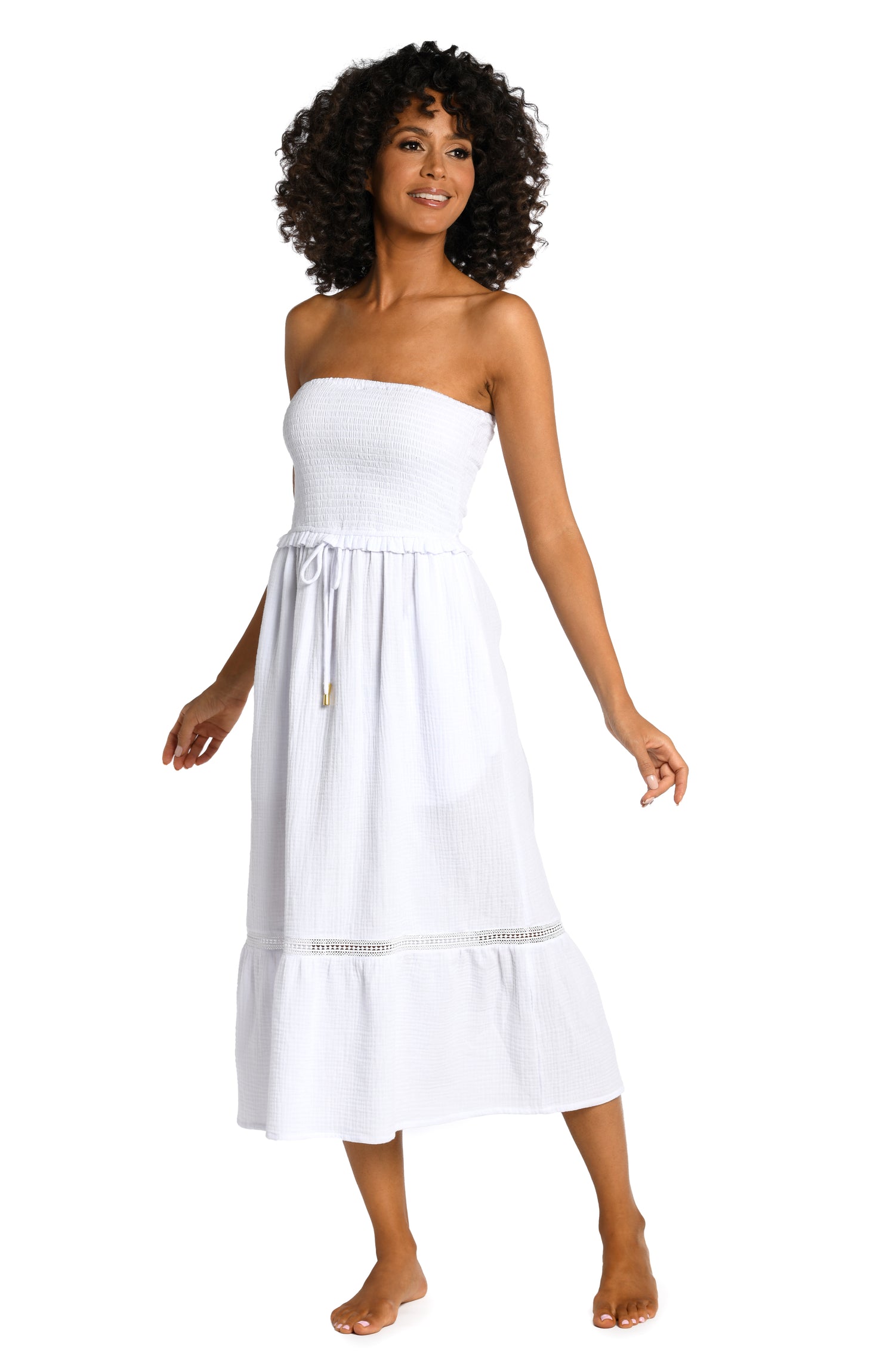 Model is wearing a white midi dress cover up from our Seaside Covers collection!