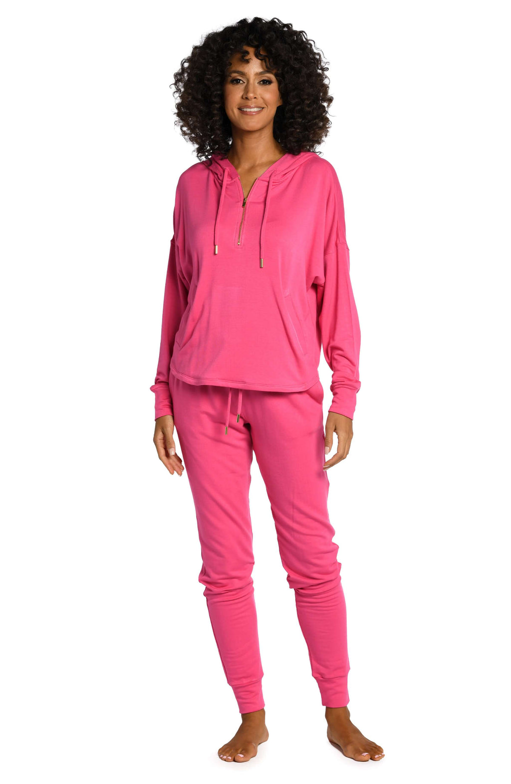 Model is wearing a pop pink colored knitted joggers from our Living in Leisure collection!