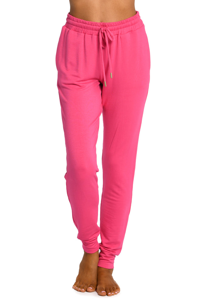 Model is wearing a pop pink colored knitted joggers from our Living in Leisure collection!
