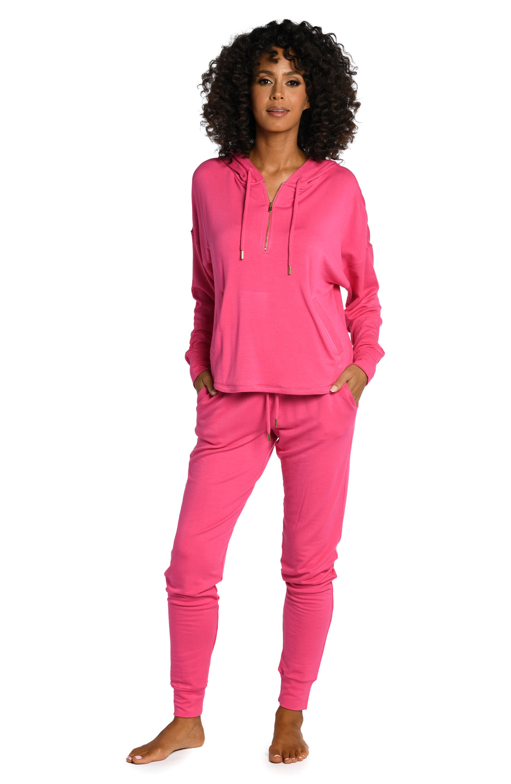 Model is wearing a pop pink colored knitted joggers from our Living in Leisure collection!
