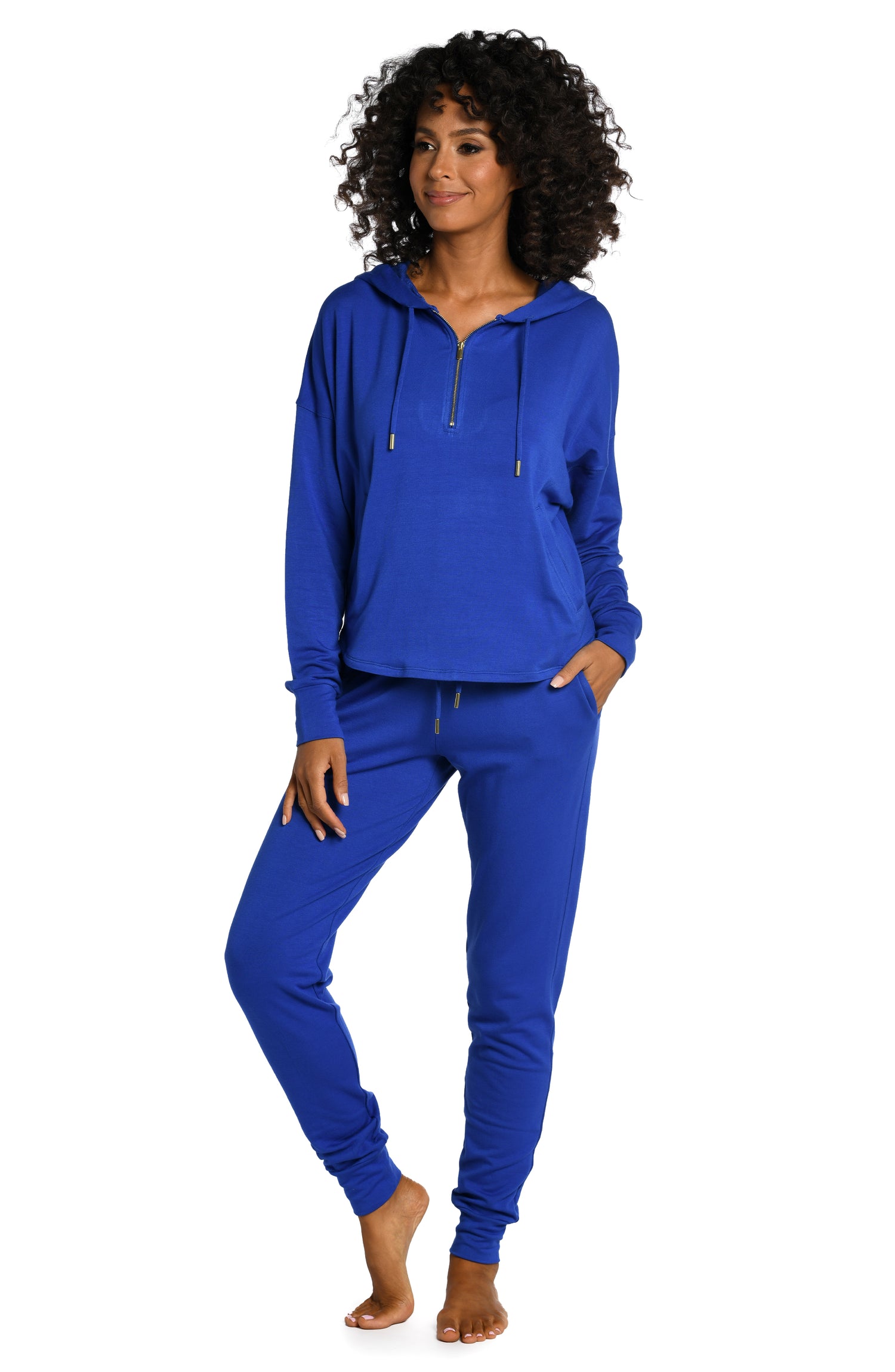 Model is wearing a sapphire colored knitted joggers from our Living in Leisure collection!