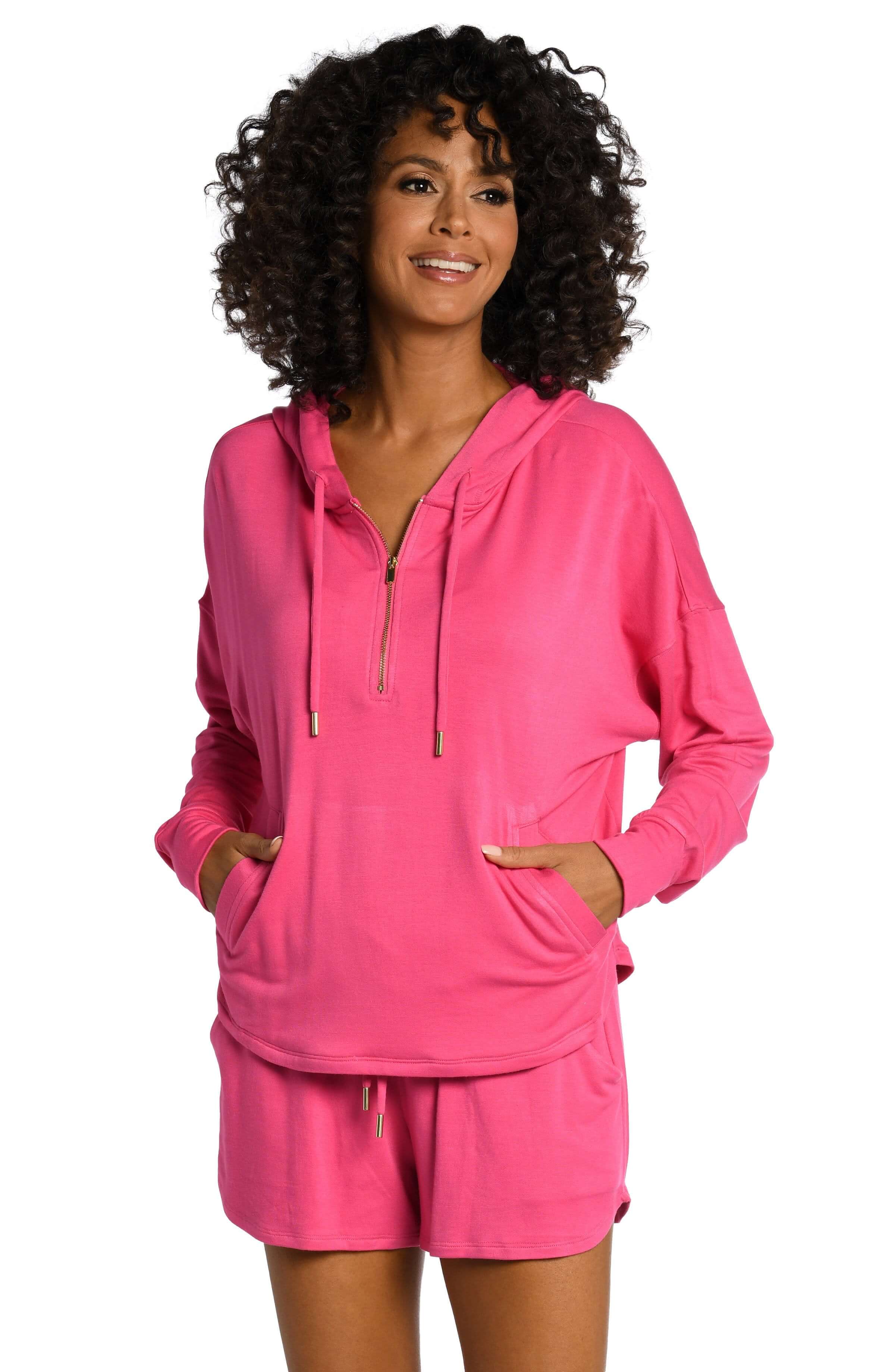 Model is wearing a pop pink colored knitted joggers from our Living in Leisure collection!