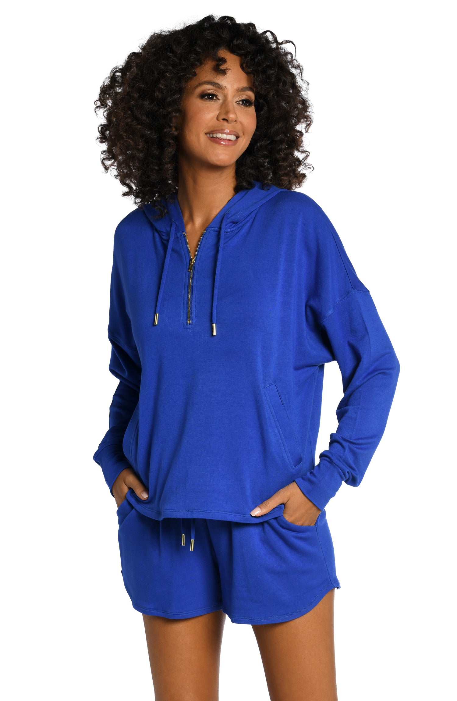 Model is wearing a sapphire colored hooded sweater from our Living in Leisure collection!