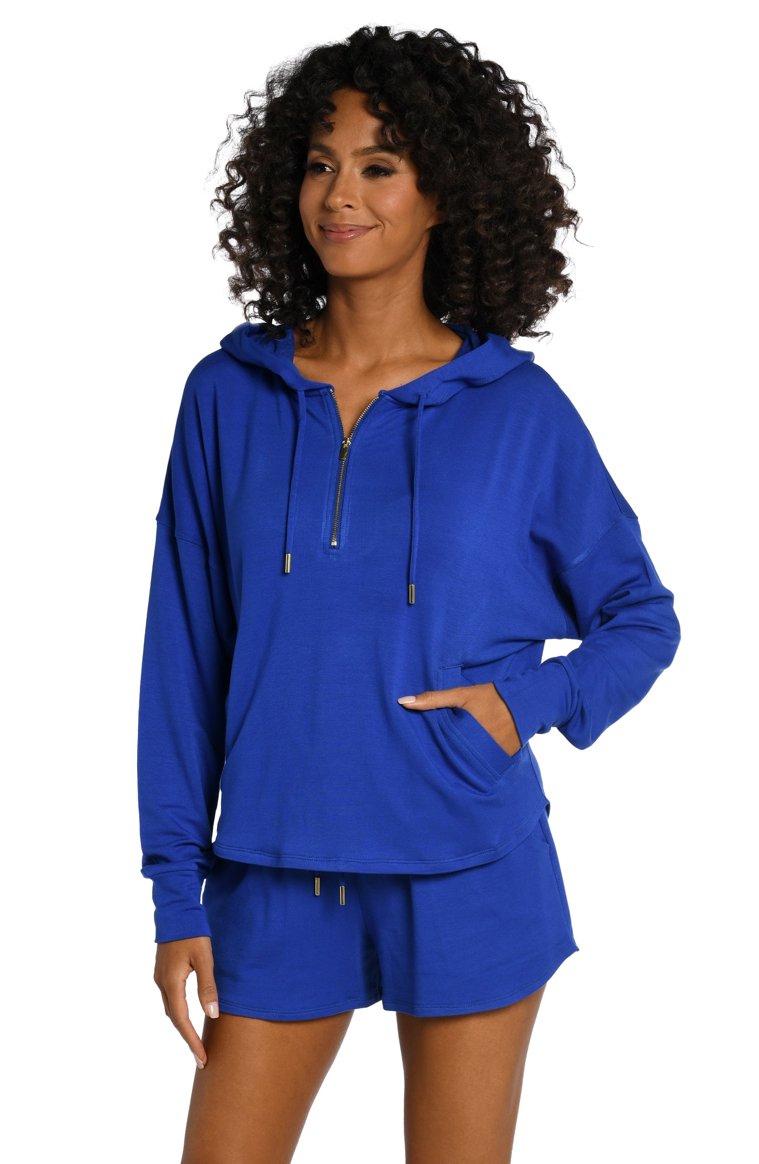 Model is wearing a sapphire colored hooded sweater from our Living in Leisure collection!