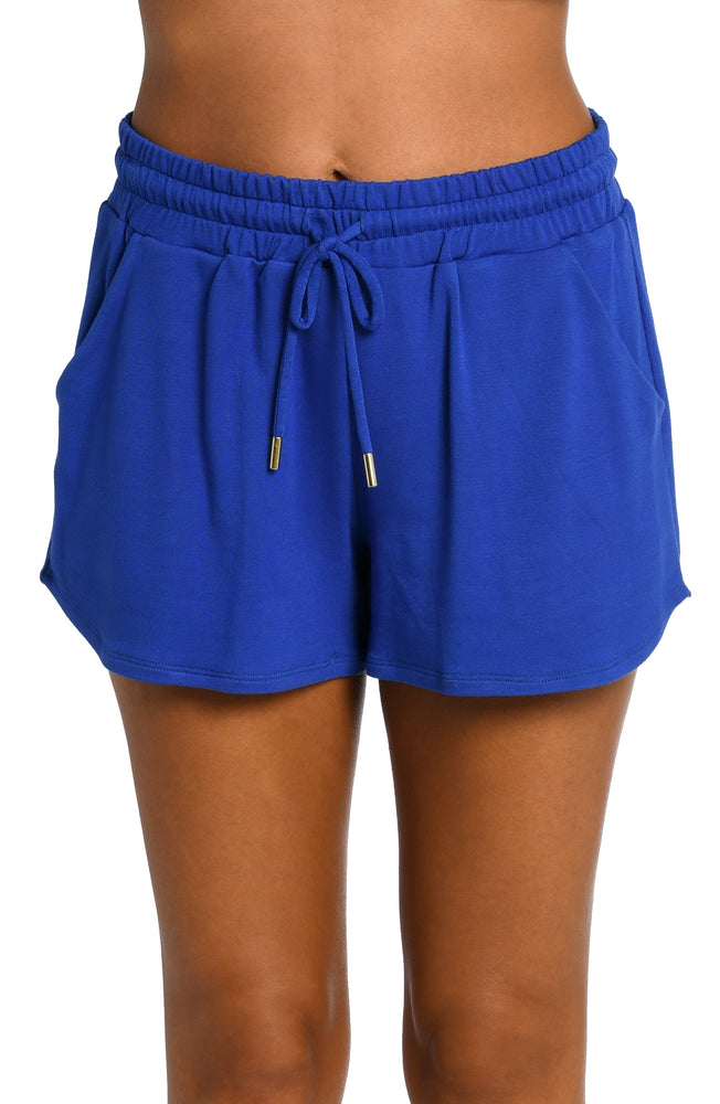Model is wearing a sapphire colored knitted shorts from our Living in Leisure collection!