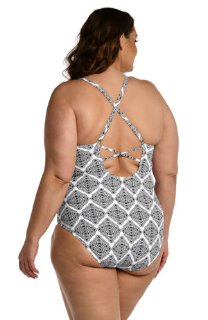 Model is wearing a black and white geometric printed strappy back one piece from our Oasis Tile collection!
