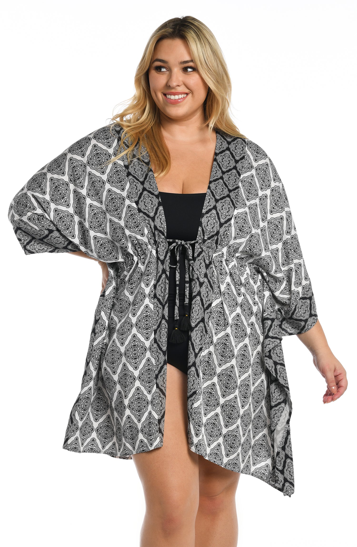 Model is wearing a black and white geometric printed kimono cover up from our Oasis Tile collection!
