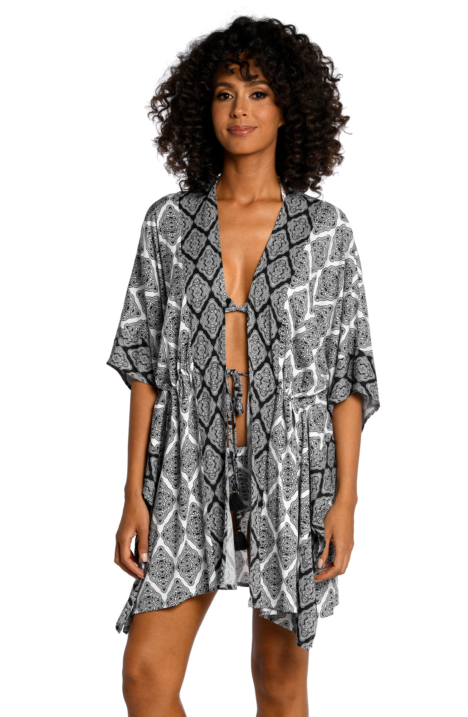 Model is wearing a black and white geometric printed kimono cover up from our Oasis Tile collection!