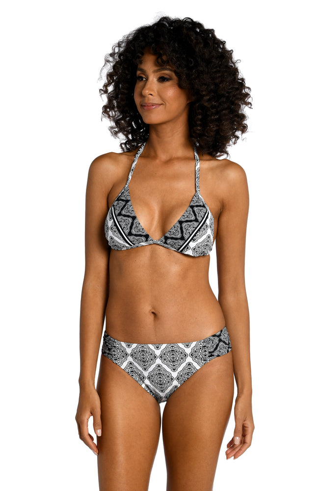
            
                Load image into Gallery viewer, Model is wearing a black and white geometric printed halter triangle top from our Oasis Tile collection!
            
        