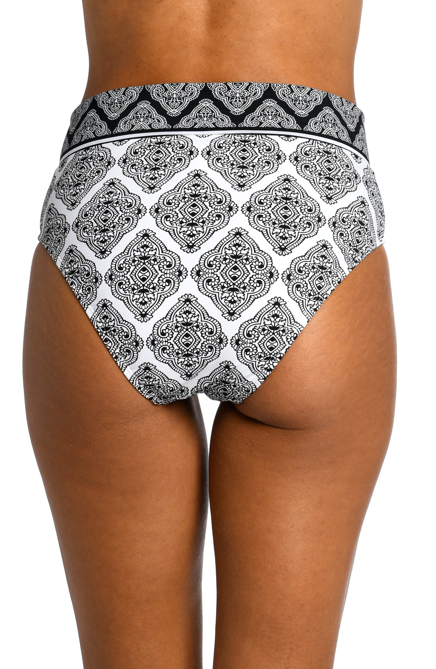 Model is wearing a black and white geometric printed crossover high waist bottom from our Oasis Tile collection!