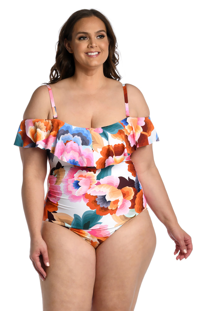 
            
                Load image into Gallery viewer, Model is wearing a multi colored floral printed off shoulder ruffle one piece from our Floral Rhythm collection!
            
        