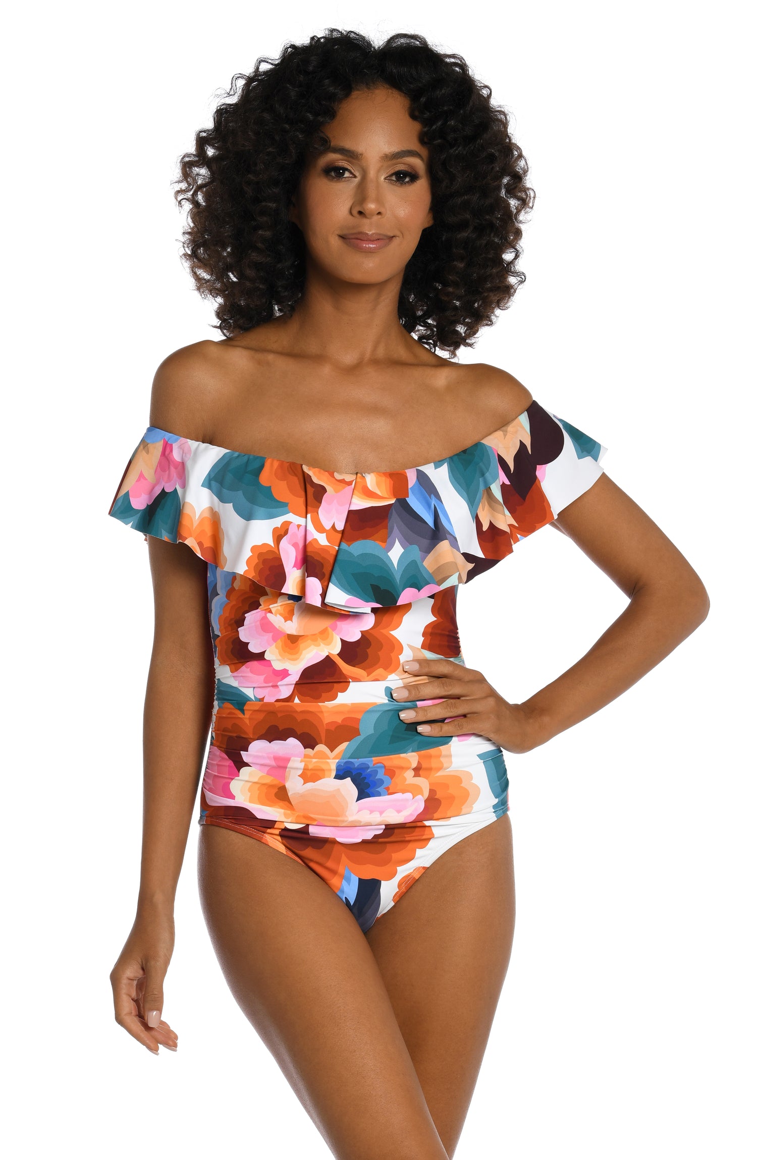 Model is wearing a multi colored floral printed off shoulder ruffle one piece from our Floral Rhythm collection!