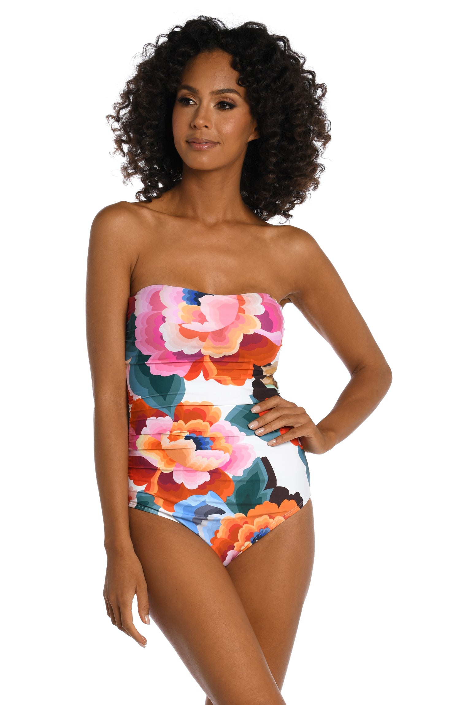 Model is wearing a multi colored floral printed bandeau one piece from our Floral Rhythm collection!