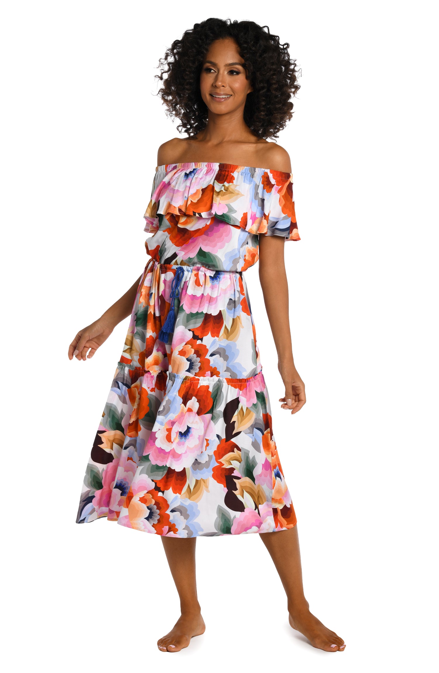 Model is wearing a multi colored floral printed off shoulder cover up dress from our Floral Rhythm collection!