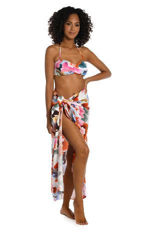 Model is wearing a multi colored floral printed pareo wrap cover up from our Floral Rhythm collection!