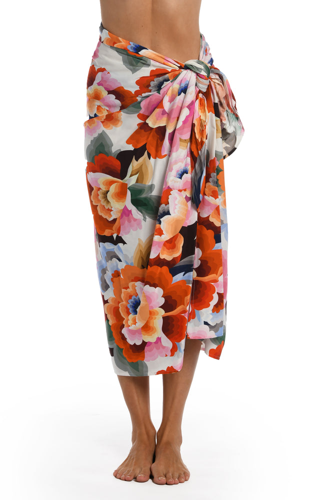Model is wearing a multi colored floral printed pareo wrap cover up from our Floral Rhythm collection!