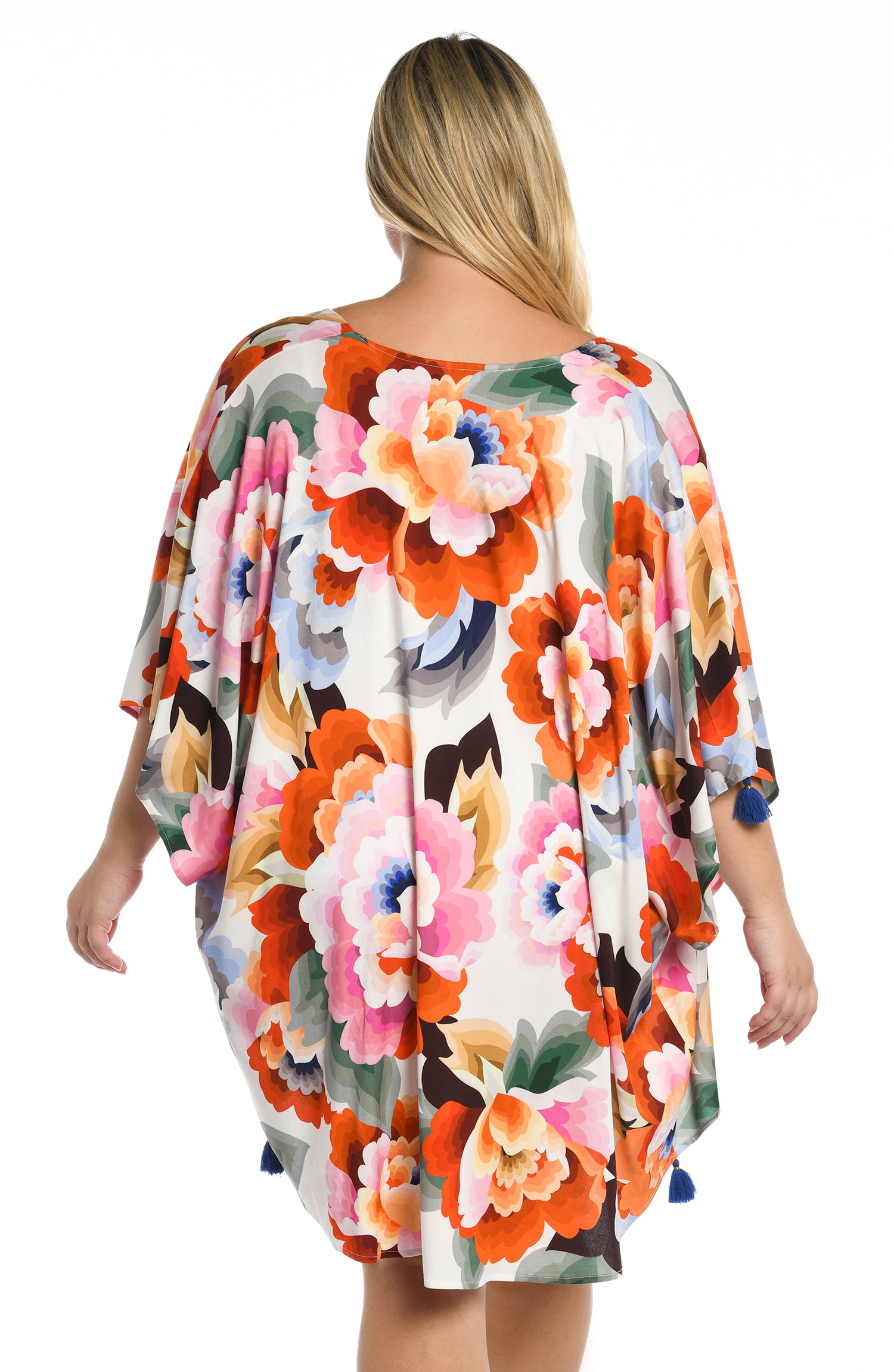 Model is wearing a multi colored floral printed kimono cover up from our Floral Rhythm collection!