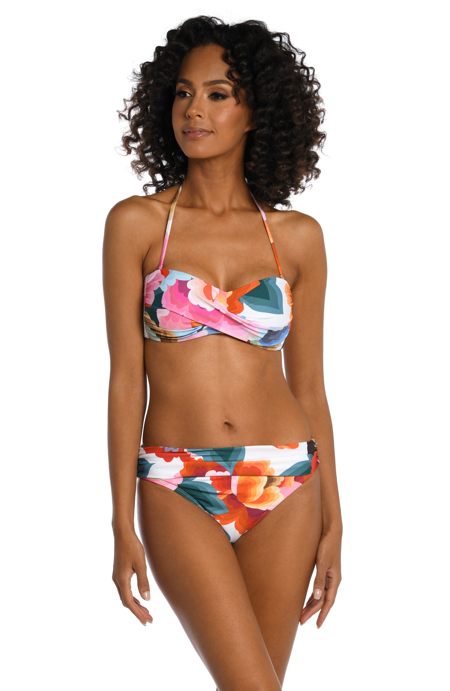 Model is wearing a multi colored floral printed bandeau top from our Floral Rhythm collection!