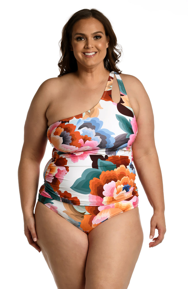 
            
                Load image into Gallery viewer, Model is wearing a multi colored floral printed keyhole tankini top from our Floral Rhythm collection!
            
        