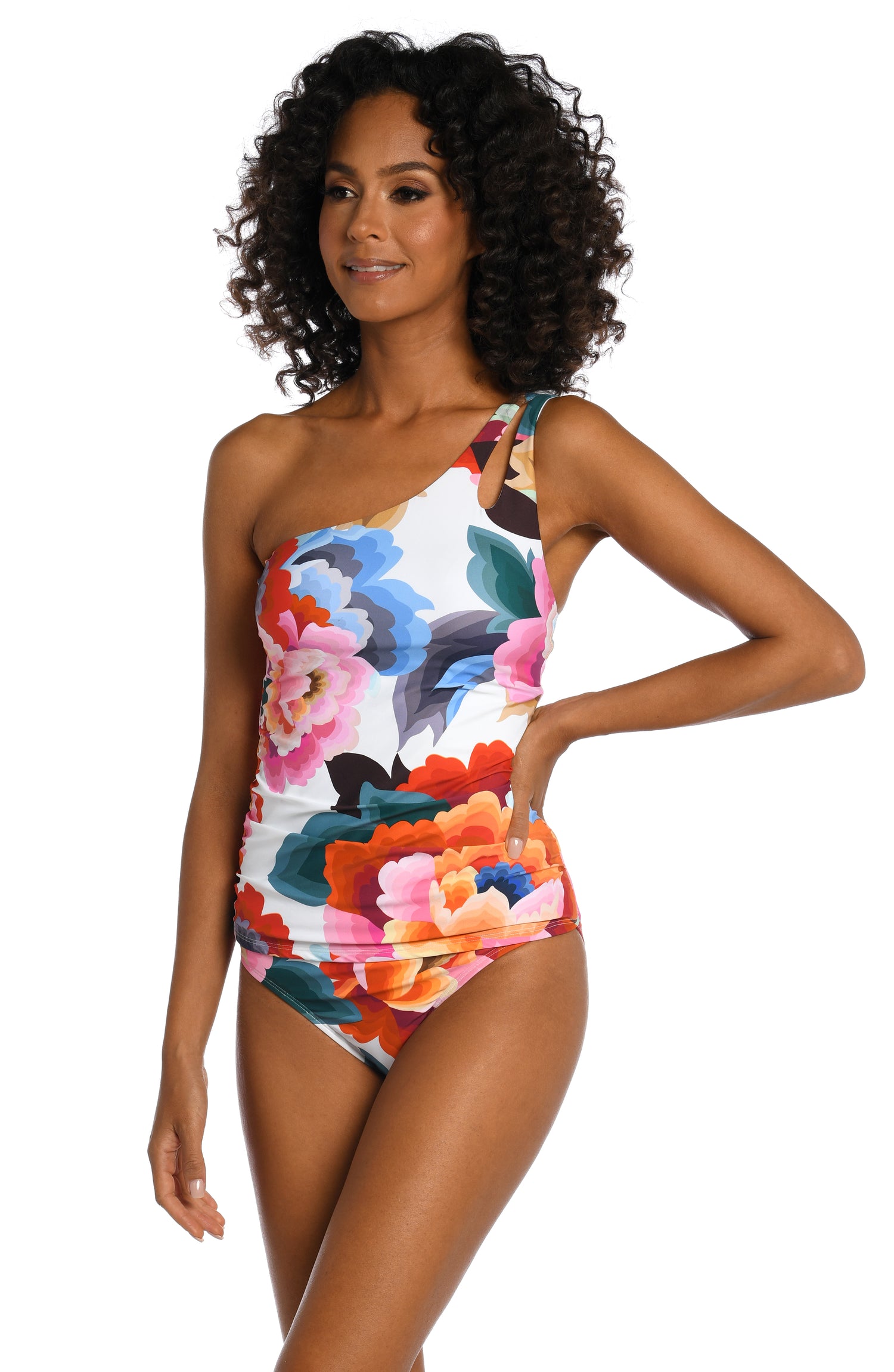 Model is wearing a multi colored floral printed keyhole tankini top from our Floral Rhythm collection!