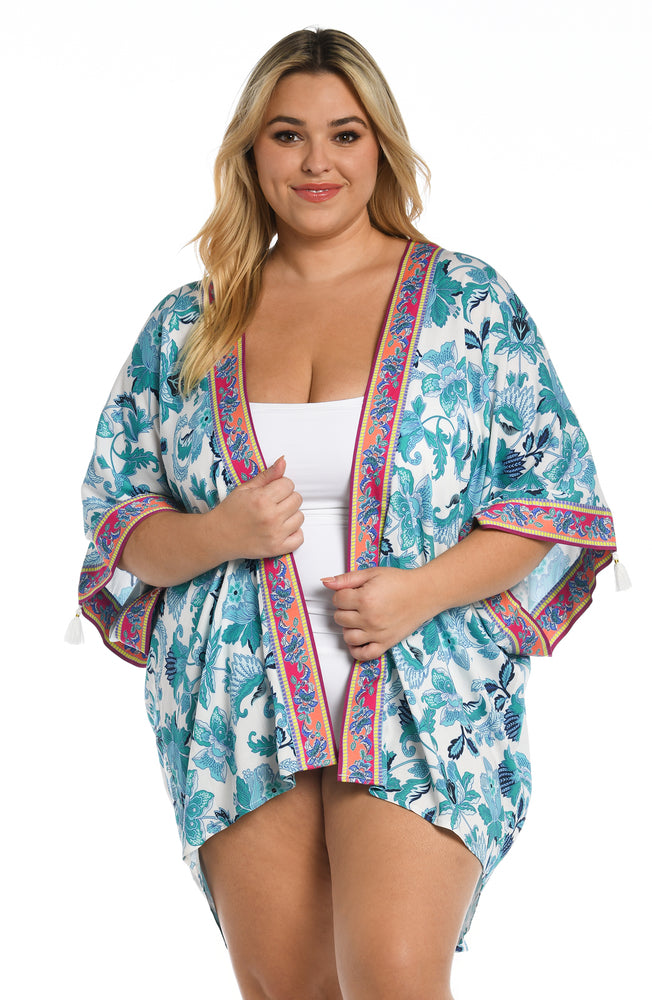 
            
                Load image into Gallery viewer, Model is wearing a light blue multi colored mediterranean printed kimono cover up from our Santorini Sun collection!
            
        