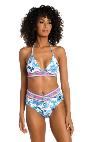 
            
                Load image into Gallery viewer, Model is wearing a light blue multi colored mediterranean printed banded halter triangle top from our Santorini Sun collection!
            
        