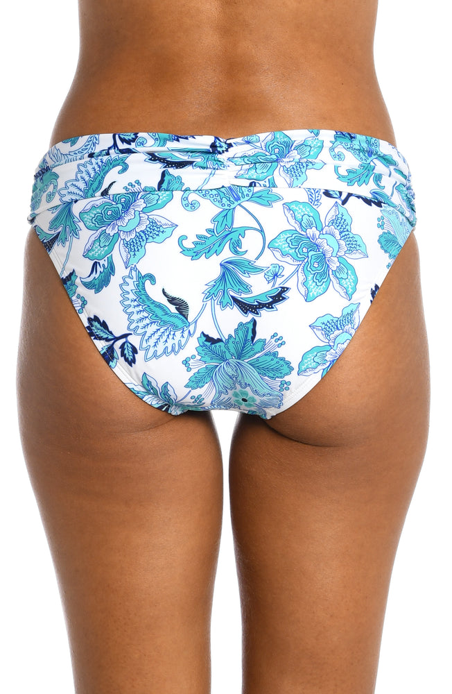 
            
                Load image into Gallery viewer, Model is wearing a light blue multi colored mediterranean printed shirred band hipster bottom from our Santorini Sun collection!
            
        