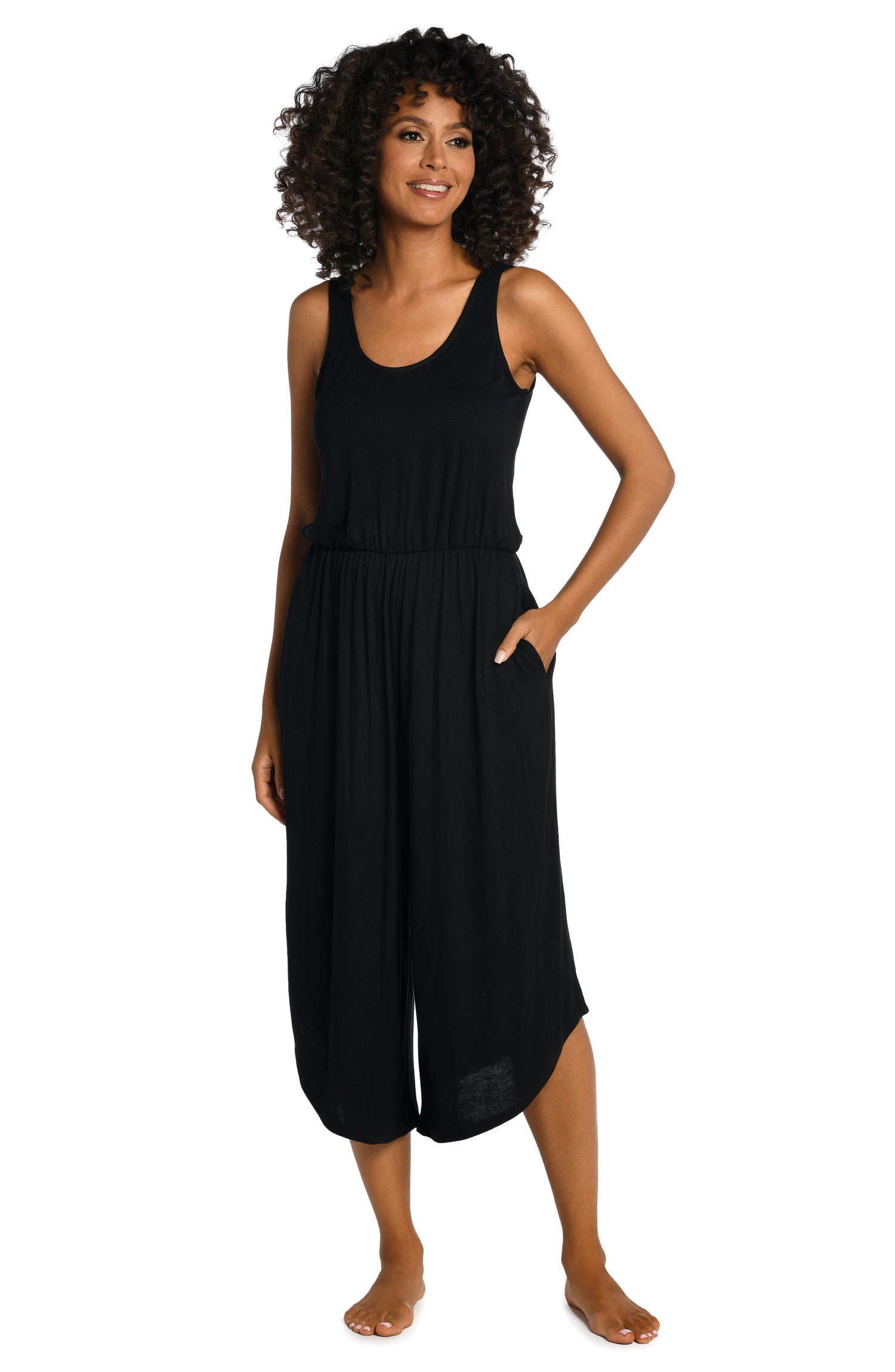 Model is wearing a black jumpsuit swimsuit cover up from our Draped Darling collection.