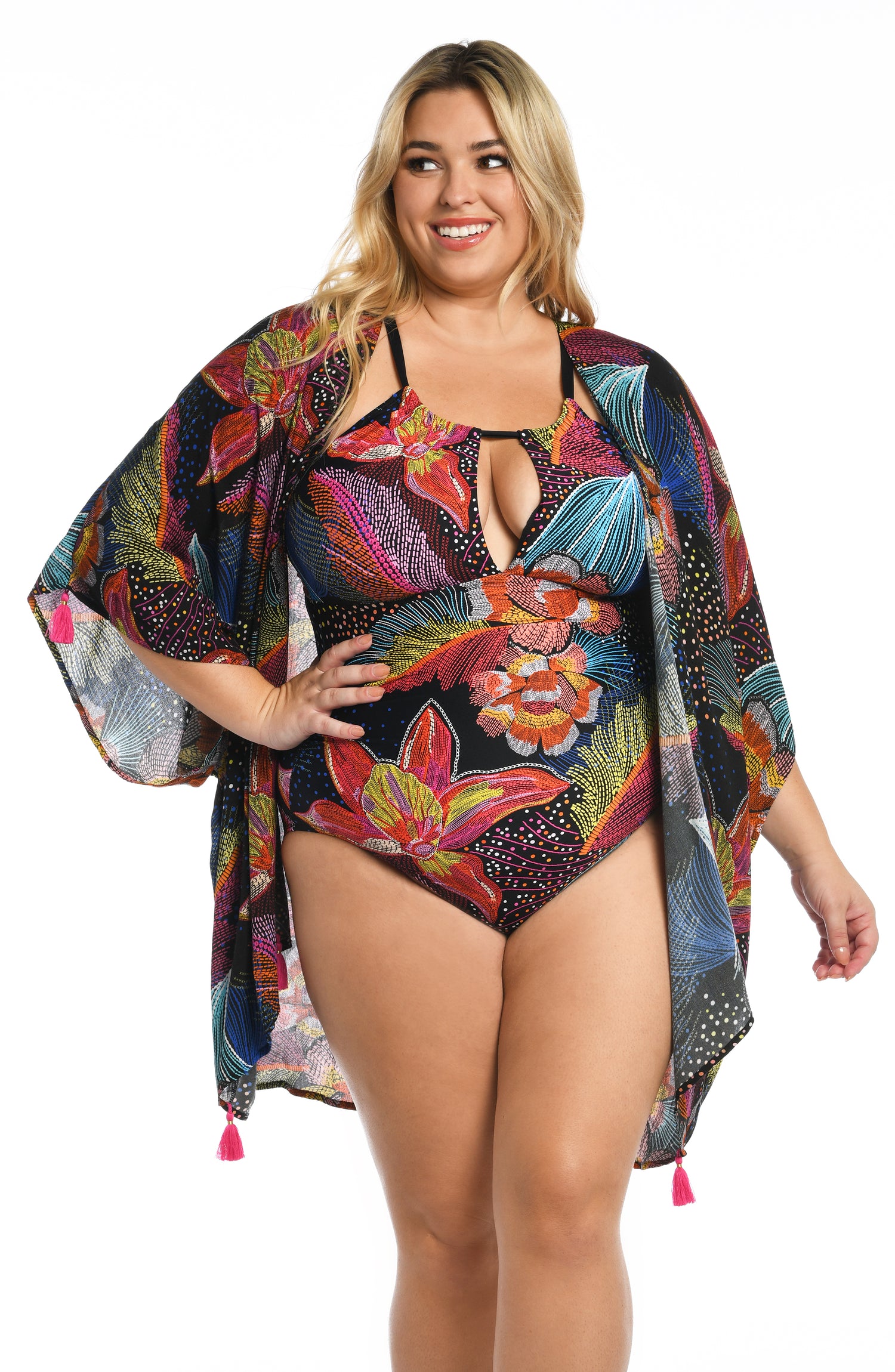 Model is wearing a shiny multicolored tropical printed kimono cover up from our Sunlit Soriee collection!