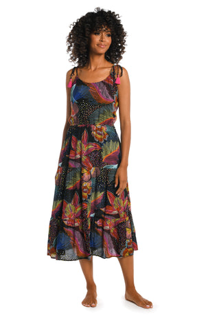 Model is wearing a shiny multicolored tropical printed maxi dress cover up from our Sunlit Soriee collection!
