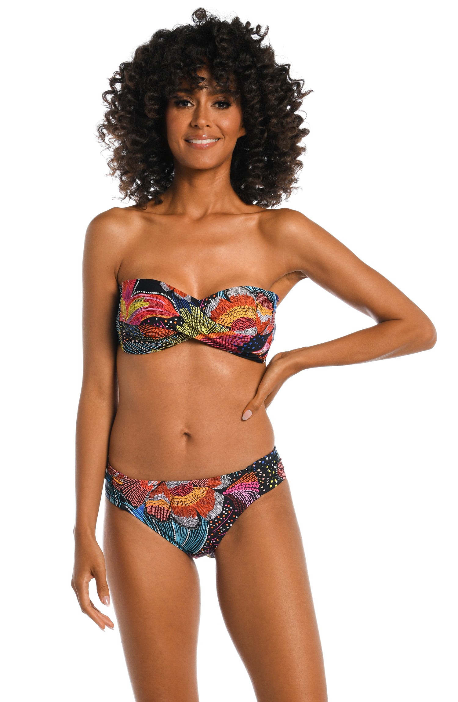 Model is wearing a shiny multicolored tropical printed bandeau top from our Sunlit Soriee collection!