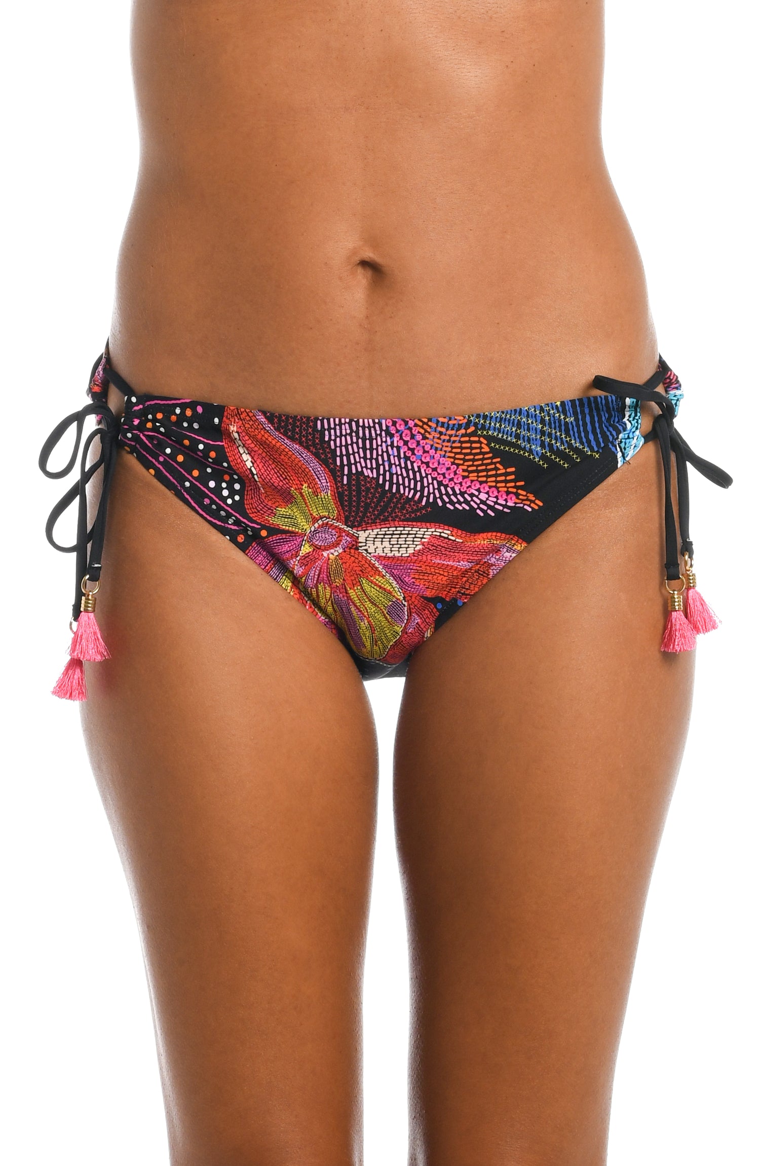 Model is wearing a shiny multicolored tropical printed side tie hipster bottom from our Sunlit Soriee collection!
