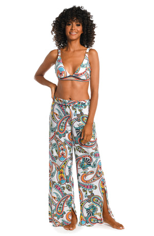 Model is wearing a multi colored paisley printed cover up pants from our Pave the Way collection!