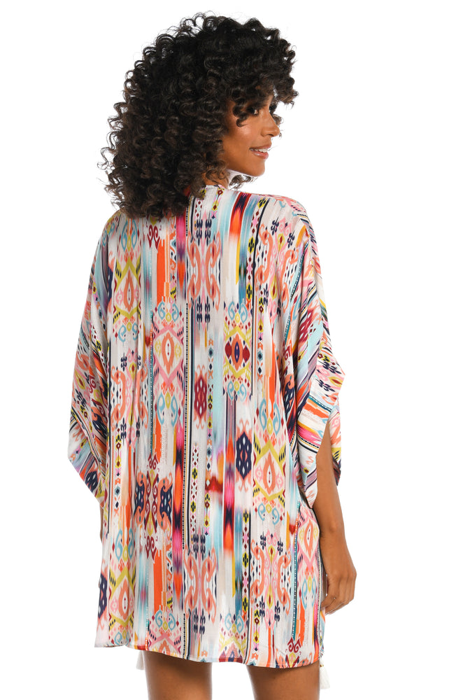 Model is wearing a multi colored tribal printed kimono cover up from our Desert Dream collection!