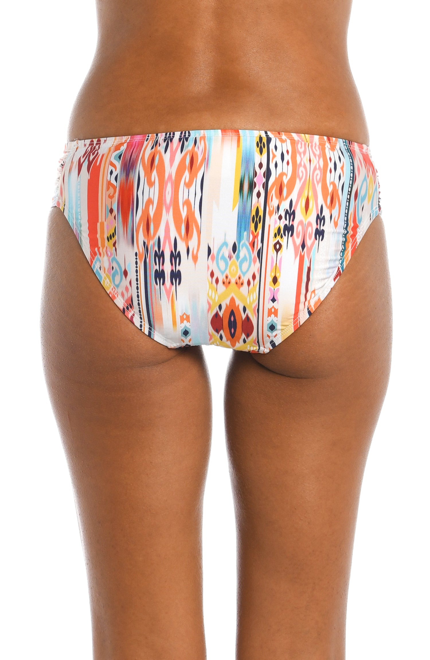 Model is wearing a multi colored tribal printed side tie hipster bottom from our Desert Dream collection!