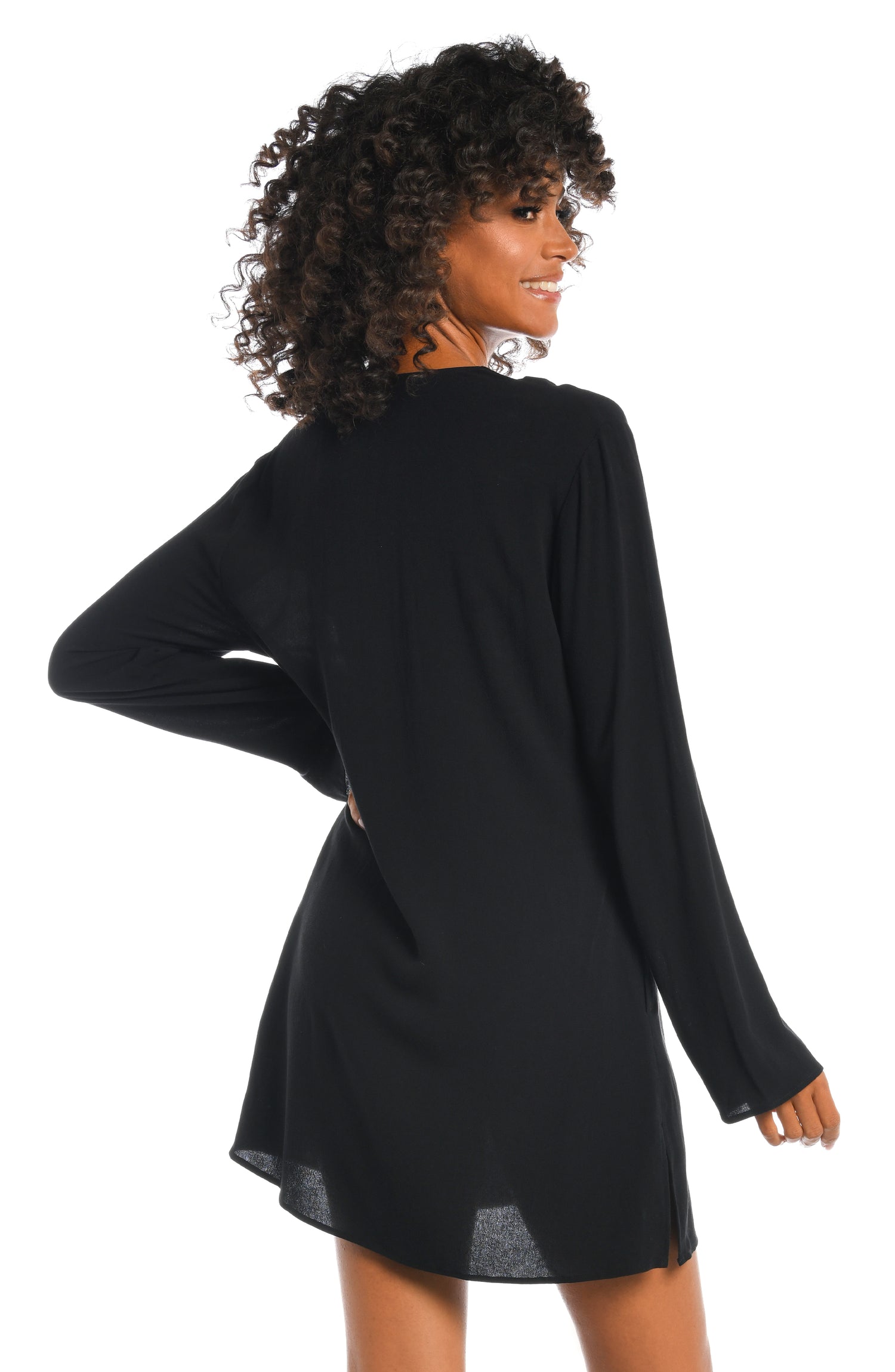 Model is wearing a solid black v-neck tunic over up from our Beachcomber Basics collection!