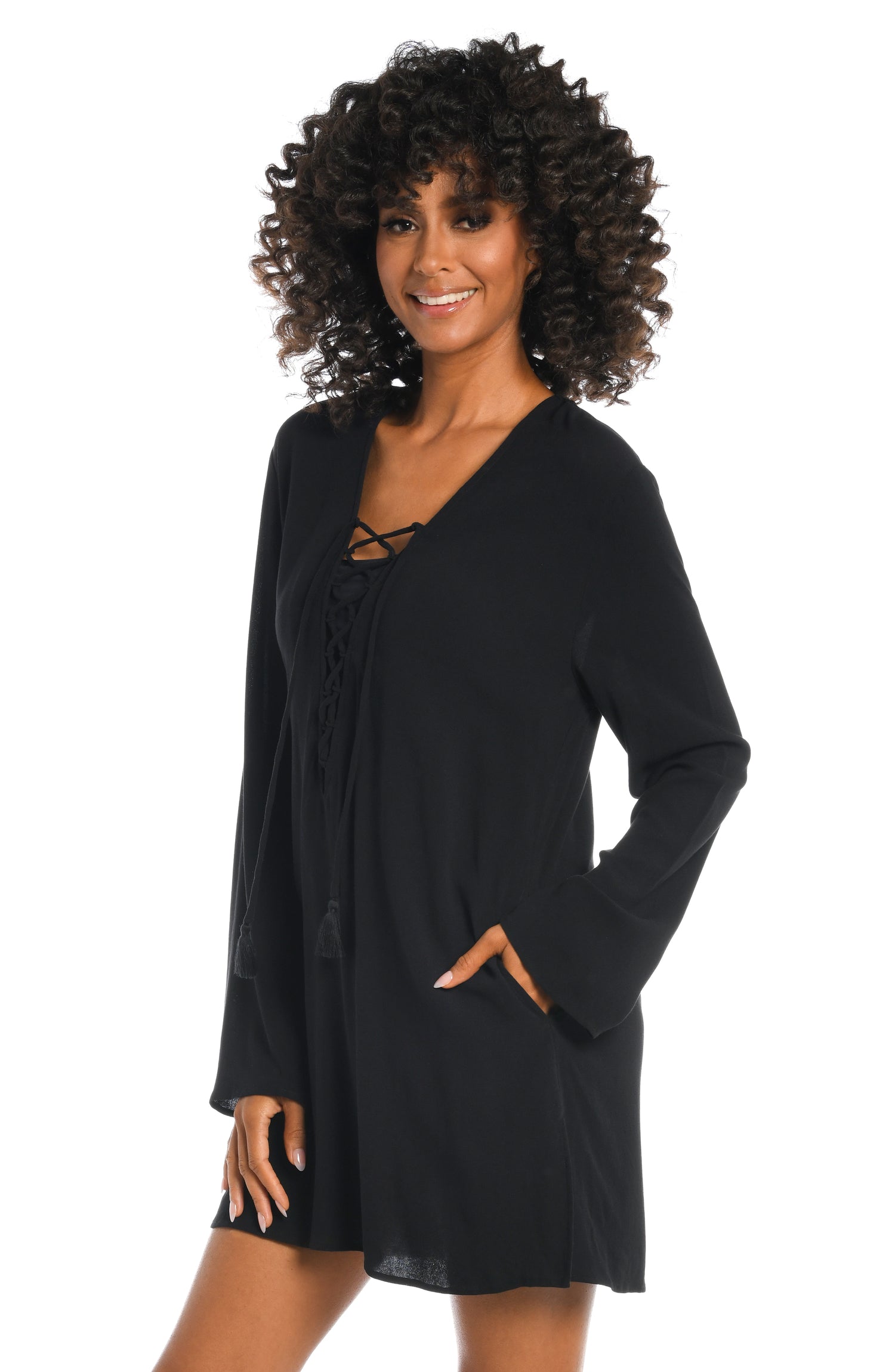 Model is wearing a solid black v-neck tunic over up from our Beachcomber Basics collection!