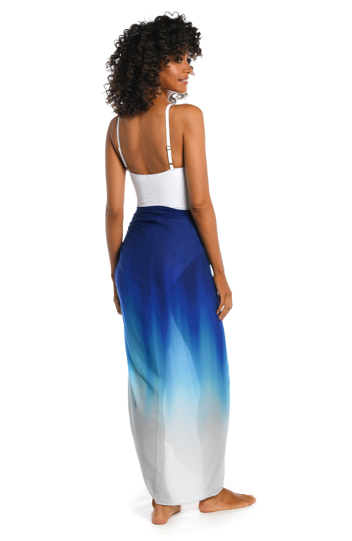 Model is wearing a sapphire colored ombre printed sarong pareo cover up from our Ocean Oasis collection!