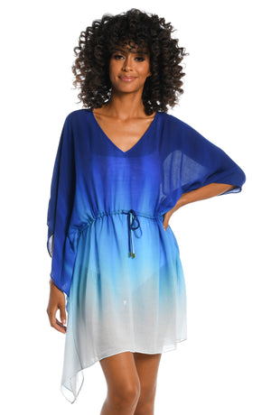 Model is wearing a sapphire colored ombre printed dress dress cover up from our Ocean Oasis collection!