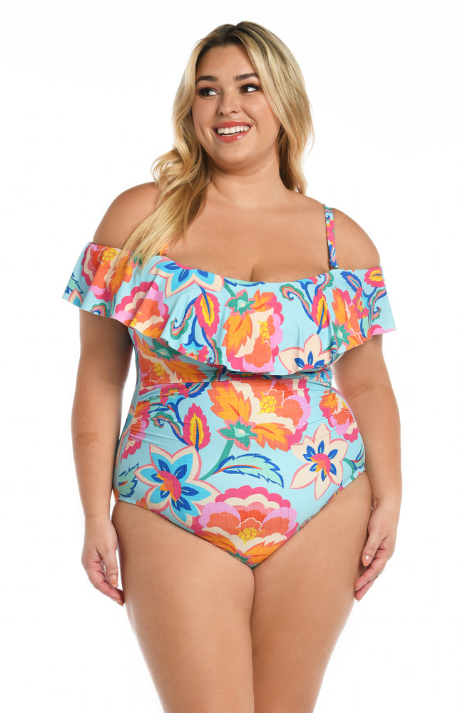 Model is wearing a light blue multi colored tropical printed off shoulder one piece from our Breezy Beauty collection!