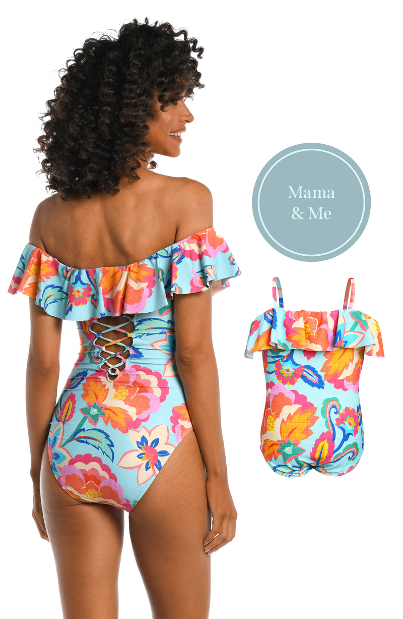 Model is wearing a light blue multi colored tropical printed off shoulder one piece from our Breezy Beauty collection!