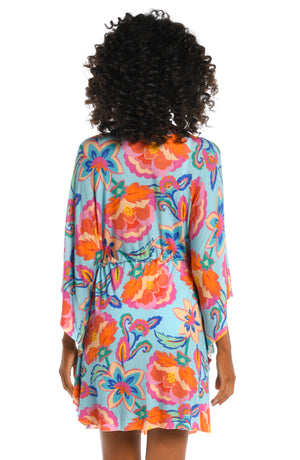 Model is wearing a light blue multi colored tropical printed tunic cover up from our Breezy Beauty collection!
