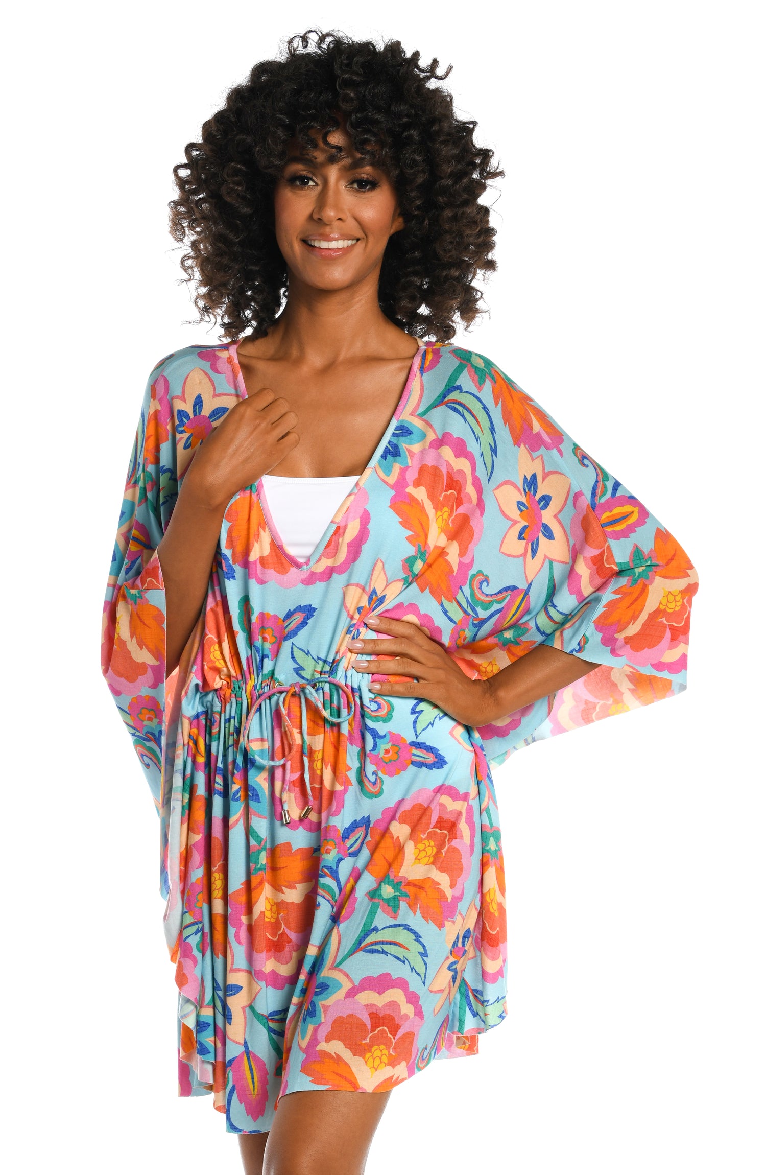 Model is wearing a light blue multi colored tropical printed tunic cover up from our Breezy Beauty collection!