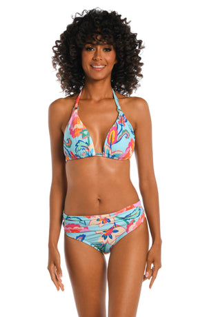 Model is wearing a light blue multi colored tropical printed halter top from our Breezy Beauty collection!