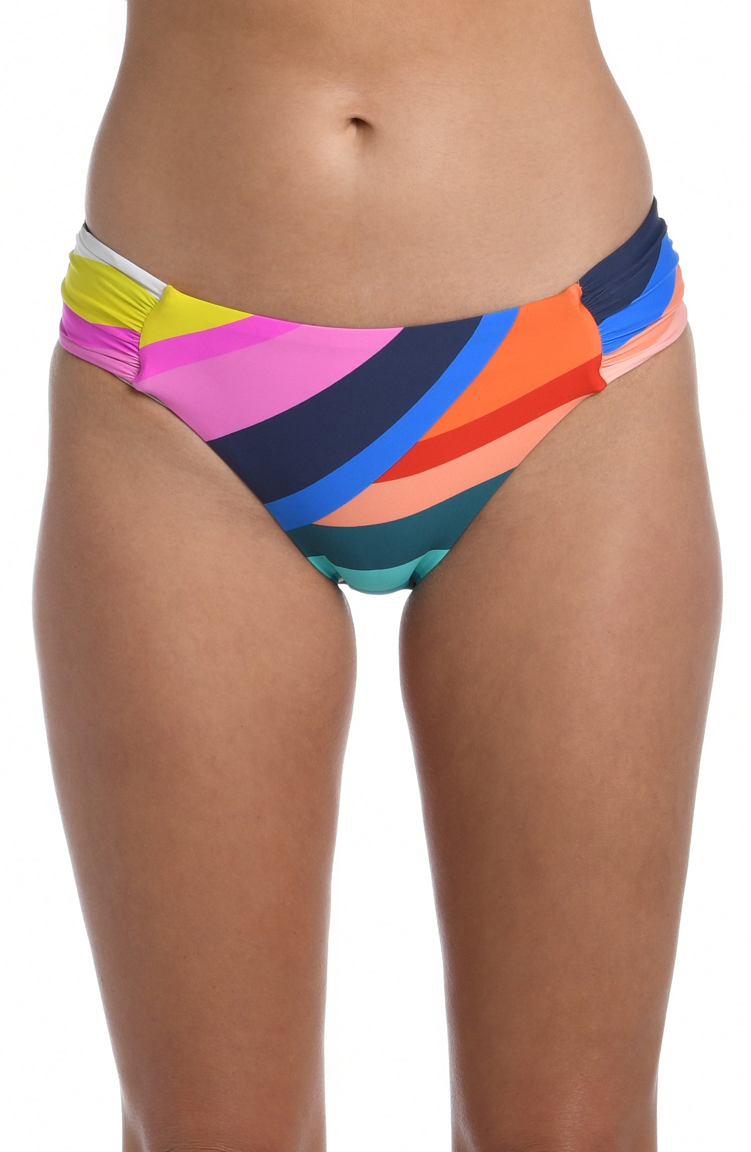 Model is wearing multi colored vibrant geometric printed side shirred hipster bottom from our Sunscape collection!