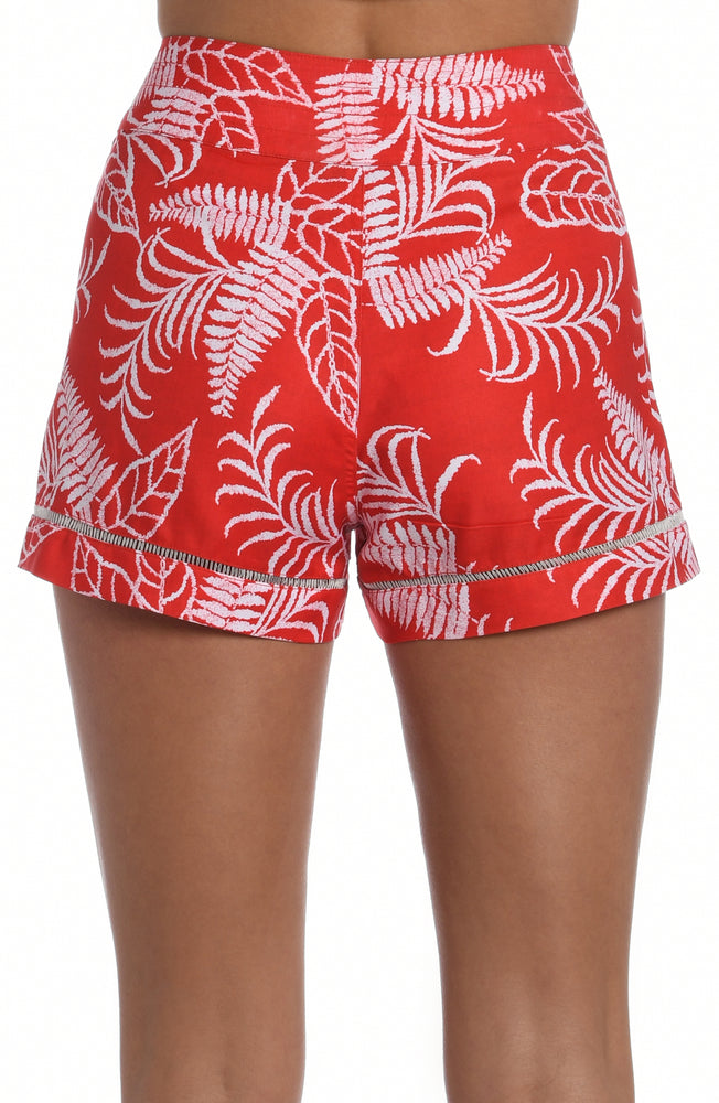 Model is wearing cherry red tropical printed 3" inseam boardshort from our Tropical Tapestry collection!
