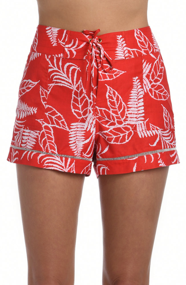 Model is wearing cherry red tropical printed 3" inseam boardshort from our Tropical Tapestry collection!