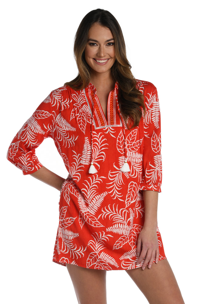 Model is wearing cherry red tropical printed v-neck tunic cover up from our Tropical Tapestry collection!