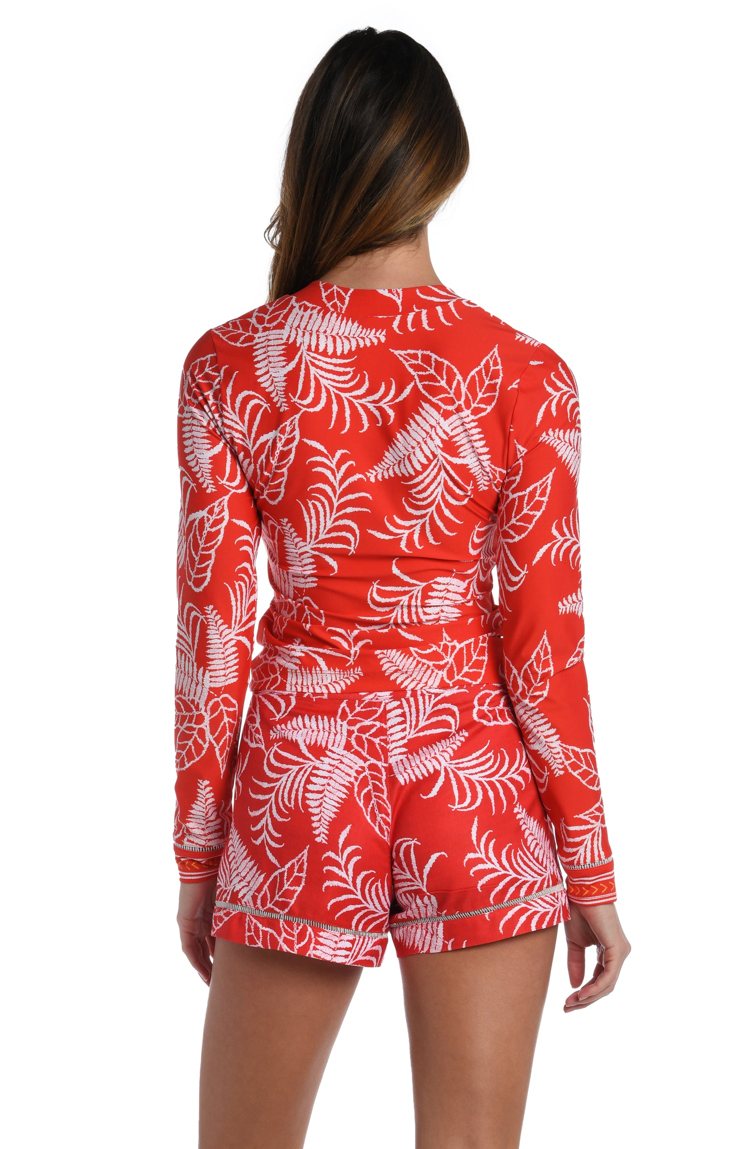 Model is wearing cherry red tropical printed half zip rashguard top up from our Tropical Tapestry collection!