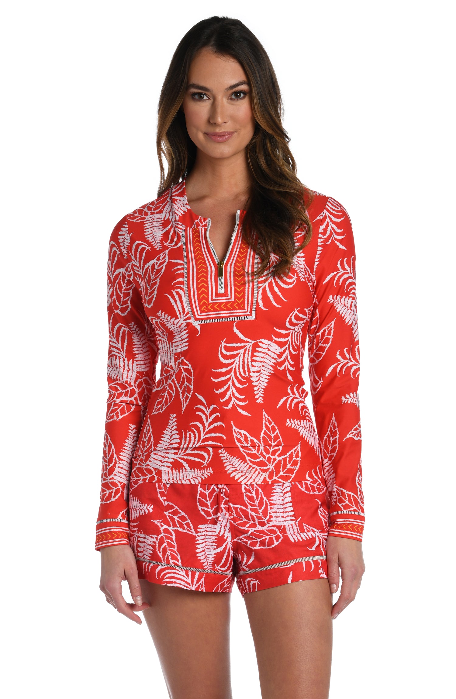 Model is wearing cherry red tropical printed half zip rashguard top up from our Tropical Tapestry collection!